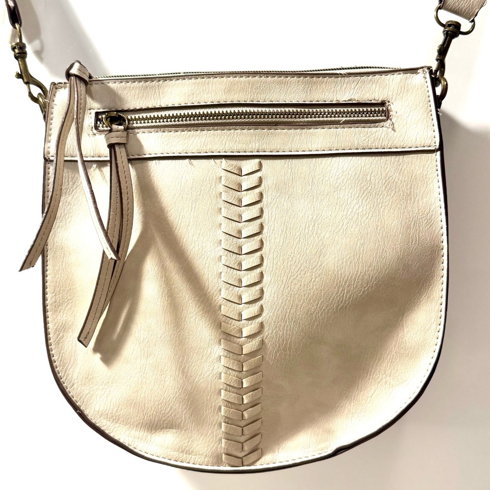 Cream Crossbody Bag with Saddle Shape and Tassel Accents